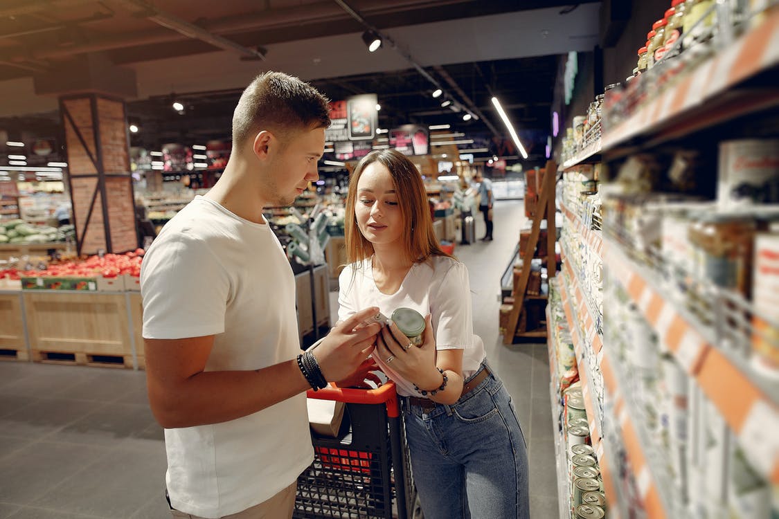 Free Young couple selecting food in market Stock Photo